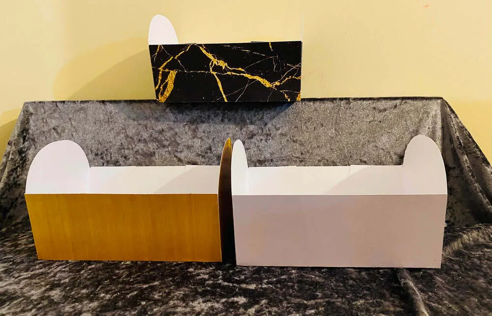 Empty small hamper boxes in black marble and plain white card