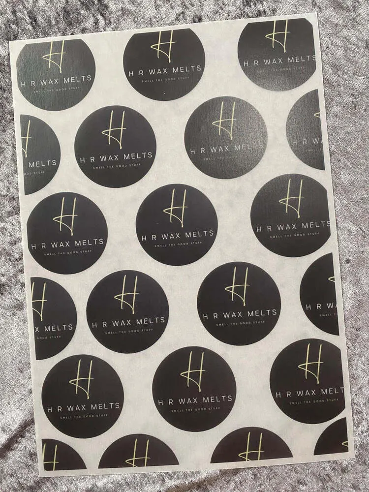 Vellum sheet printed with rows of dark grey logo circles