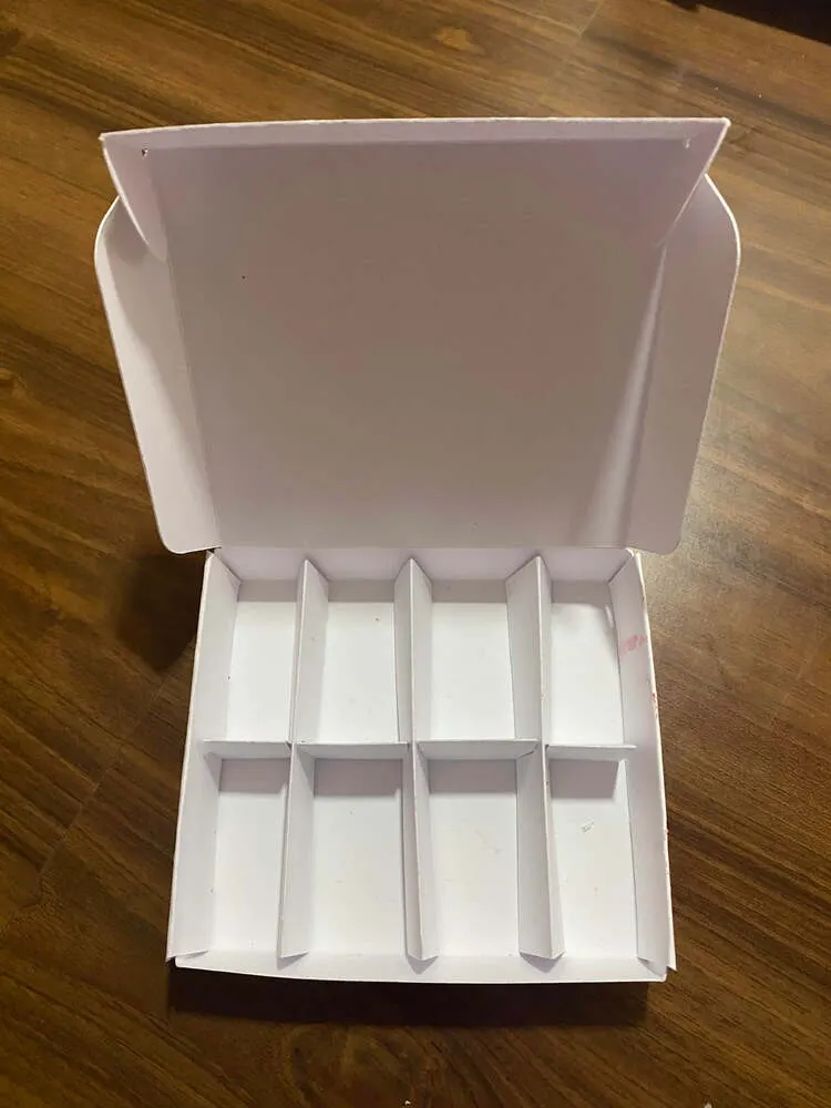Open white 8-cell cardboard box with slot-in dividers